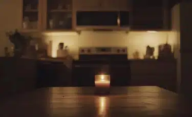 A candle illuminated a part of the house that has no power.